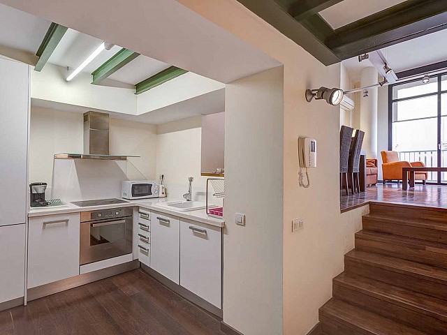 Equipped and funcitonal kitchen in luxurious apartment in building for sale in Barcelona