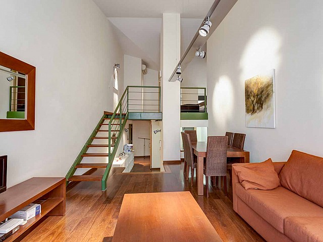 Bright and spacious living room in luxurious apartment in building for sale in Barcelona