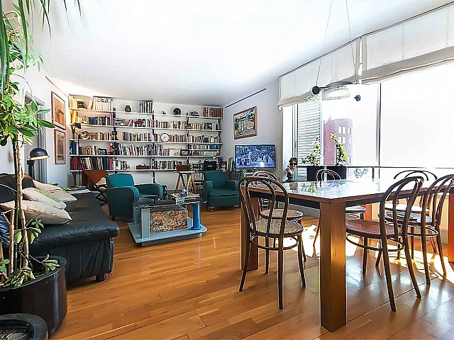 bright dining room connected to the living room in luxurious apartment to rent in barcelona